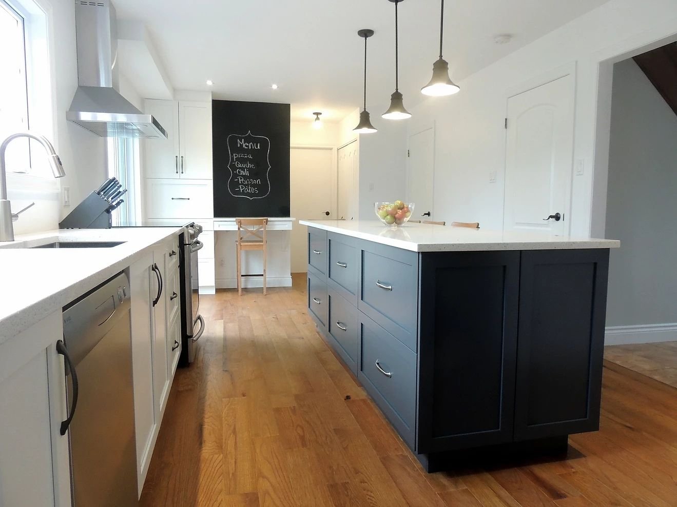 White kitchen with a blue island as a colour accent